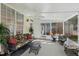 Beautiful sunroom featuring wicker furniture, a ceiling fan, and views of the backyard at 3213 Kirby St, Durham, NC 27713