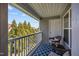 Inviting outdoor balcony with seating and a view of lush green trees at 3471 Forestdale Drive # 3C, Burlington, NC 27215