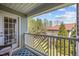 Charming balcony with a patterned blue rug and open views of the surrounding trees at 3471 Forestdale Drive # 3C, Burlington, NC 27215