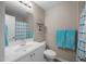 Bathroom featuring a vanity with a white sink, neutral walls, and a framed mirror at 3471 Forestdale Drive # 3C, Burlington, NC 27215