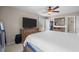 Well-appointed bedroom with large TV, dresser, and a view from the window filling the space with natural light at 3471 Forestdale Drive # 3C, Burlington, NC 27215