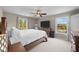 Bright bedroom with ceiling fan, two windows, and a spacious layout with hardwood furnishings at 3471 Forestdale Drive # 3C, Burlington, NC 27215