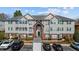 Traditional condominium featuring neutral siding, green shutters, and manicured landscaping at 3471 Forestdale Drive # 3C, Burlington, NC 27215