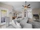Spacious living room features a modern sectional couch, ceiling fan, and neutral decor at 3471 Forestdale Drive # 3C, Burlington, NC 27215