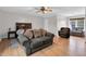 A spacious primary bedroom is displayed with hardwood floors, a sitting area, and neutral paint at 384 Rocky Run Ln, Lillington, NC 27546