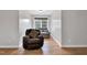 The large bedroom has hardwood floors and neutral colors with a cozy sitting area and a great window view at 384 Rocky Run Ln, Lillington, NC 27546
