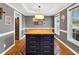 Dining room features a large kitchen island with bar stool seating, storage drawers, and updated lighting at 384 Rocky Run Ln, Lillington, NC 27546