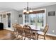 Inviting dining room features hardwood floors and large windows letting in lots of natural light at 384 Rocky Run Ln, Lillington, NC 27546