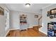 Welcoming entryway with hardwood floors, stairs and an antique hutch at 384 Rocky Run Ln, Lillington, NC 27546
