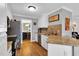 Well-appointed kitchen featuring granite countertops, stainless steel appliances, and white cabinetry at 384 Rocky Run Ln, Lillington, NC 27546