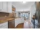 Open-concept kitchen with stainless steel appliances and a breakfast nook at 384 Rocky Run Ln, Lillington, NC 27546