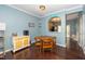 The dining area features hardwood floors and a view into the kitchen at 4114 Brenmar Ln, Durham, NC 27713