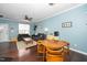 A combined dining room and living room with lots of natural light and hardwood flooring at 4114 Brenmar Ln, Durham, NC 27713
