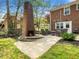 Backyard patio with cozy fireplace and ample seating, perfect for outdoor gatherings at 416 Avery St, Garner, NC 27529
