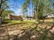 Spacious backyard with mature trees and a fenced perimeter offering privacy at 416 Avery St, Garner, NC 27529