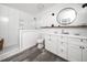 Modern bathroom featuring double sink vanity, walk-in glass shower, and contemporary finishes at 416 Avery St, Garner, NC 27529