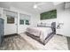 Comfortable bedroom with a bed, ensuite door, fan and a cozy rug, perfect for relaxation at 416 Avery St, Garner, NC 27529