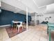 Inviting living room with stylish furniture, recessed lighting, and bright blue accent wall at 416 Avery St, Garner, NC 27529