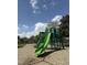 Colorful playground featuring slides and climbing structures in a park setting at 416 Avery St, Garner, NC 27529