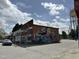 Charming street corner with local store, mural and a water tower in the distance at 416 Avery St, Garner, NC 27529