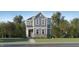 Charming two-story home with stone accents, manicured lawn, and inviting covered entryway at 417 Cresting Wave Dr, Wake Forest, NC 27587