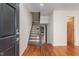 Inviting entryway featuring hardwood floors and a modern staircase at 4229 American Dr # F, Durham, NC 27705