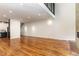 Bright living room with hardwood floors, fireplace and recessed lighting at 4229 American Dr # F, Durham, NC 27705