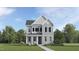 Charming two-story home with stone accents, a welcoming front porch and professionally manicured landscaping at 425 Cresting Wave Dr, Wake Forest, NC 27587