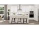 Modern kitchen with stainless steel appliances, a center island with stool seating, and sleek white cabinetry at 425 Cresting Wave Dr, Wake Forest, NC 27587