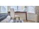 Bright bedroom featuring a desk area near a window, perfect for a home office setup or study space at 4303 Thetford Rd, Durham, NC 27707