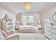 Bright bedroom featuring custom lighting, neutral color palette, and ample closet space with plush carpeting at 4303 Thetford Rd, Durham, NC 27707