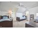 Spacious bedroom featuring two twin beds, desk, and neutral carpeting, with natural light from a window at 4303 Thetford Rd, Durham, NC 27707