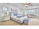 Light-filled bedroom with multiple windows, providing scenic views and a comfortable, inviting space at 4303 Thetford Rd, Durham, NC 27707