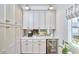 Butler's pantry with custom cabinetry, a wine fridge, and counter space is perfect for entertaining at 4303 Thetford Rd, Durham, NC 27707