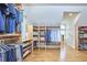 Walk-in closet with custom shelving and hanging space, providing ample storage for clothing and accessories at 4303 Thetford Rd, Durham, NC 27707