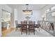 Elegant dining room with contemporary chandelier, stylish decor, and modern furniture at 4303 Thetford Rd, Durham, NC 27707