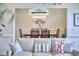 Open-concept dining room with modern lighting and decor at 4303 Thetford Rd, Durham, NC 27707