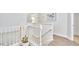 Bright hallway featuring staircase with white railing, accent lighting, and wood floors at 4303 Thetford Rd, Durham, NC 27707