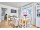 Stylish living room with a comfortable couch, dining area, and lots of natural light at 4303 Thetford Rd, Durham, NC 27707