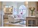 Bright living room featuring a comfortable sofa, stylish decor, and hardwood floors at 4303 Thetford Rd, Durham, NC 27707
