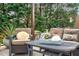 Outdoor patio featuring comfortable seating and a well-appointed table setting for relaxation at 4303 Thetford Rd, Durham, NC 27707