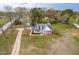 Aerial view of the house with long driveway and surrounding greenery in a residential area at 44 Loop Rd, Archer Lodge, NC 27527