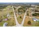 Aerial view of a residential area with houses and roads surrounded by trees at 44 Loop Rd, Archer Lodge, NC 27527