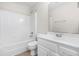 Modern bathroom features clean white fixtures, bathtub, and sleek single vanity at 44 Loop Rd, Archer Lodge, NC 27527