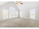 Spacious bedroom with vaulted ceiling, large windows, and cozy carpet at 44 Loop Rd, Archer Lodge, NC 27527