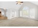 Inviting bedroom features carpet, a ceiling fan, and natural light from large windows at 44 Loop Rd, Archer Lodge, NC 27527