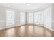 Charming dining room with large bay windows and light-colored wood flooring at 44 Loop Rd, Archer Lodge, NC 27527