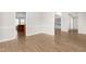 Open dining room with modern flooring offers seamless access to the kitchen and living areas at 44 Loop Rd, Archer Lodge, NC 27527