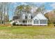 Charming two-story home with a welcoming front porch and well-maintained landscaping at 44 Loop Rd, Archer Lodge, NC 27527