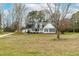 View of the house with a welcoming front porch and a wide front yard at 44 Loop Rd, Archer Lodge, NC 27527